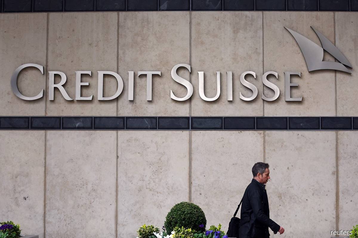 A person walks past the Credit Suisse office in Canary Wharf in London March 20, 2023. (Reuters pic)
